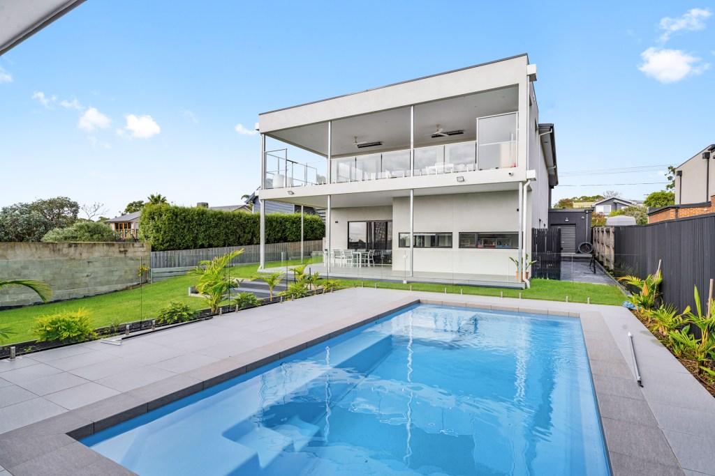 Mount Martha custom 2 storey build by Nira Homes exterior at back of home with pool and backyard